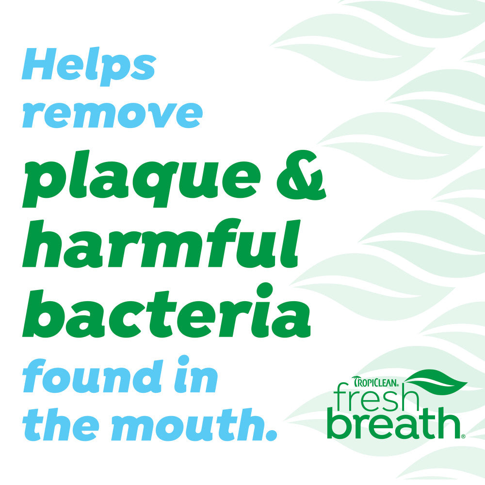 Advertisement for Tropiclean Fresh Breath dental product with text about plaque and bacteria removal.