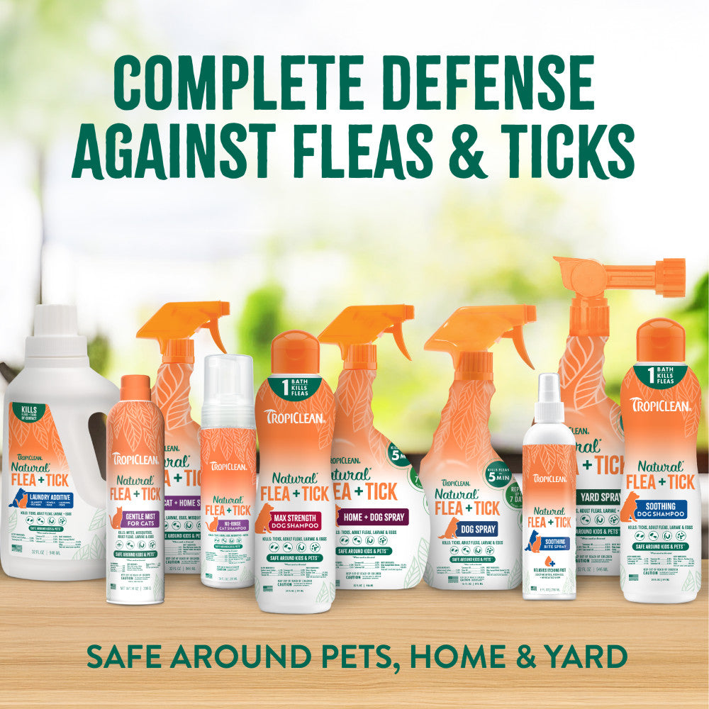 Collection of Tropiclean flea and tick treatment products on a wooden surface.