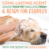 Dog being washed with TropiClean Papaya & Coconut 2-In-1 Shampoo and Conditioner for Pets suds, text about long-lasting papaya & coconut scent.