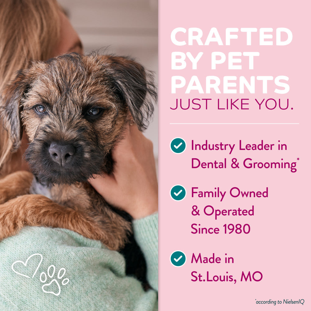 Person holding a small dog with promotional text about TropiClean pet care