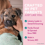 Person holding a small dog with promotional text about TropiClean pet care